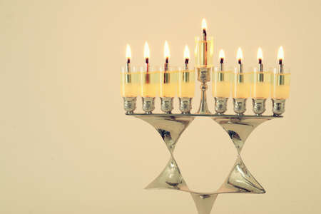 image of jewish holiday Hanukkah background with menorah (traditional candelabra) and candles