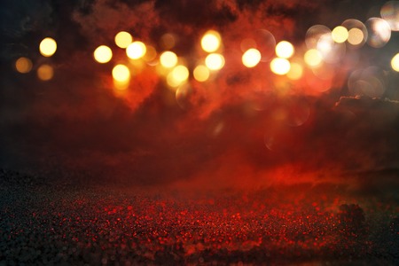 black and red glitter lights background. defocused.の写真素材