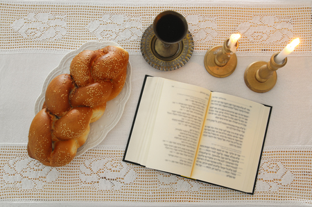 shabbat image. challah bread, shabbat wine and candles on the table. Top viewの写真素材