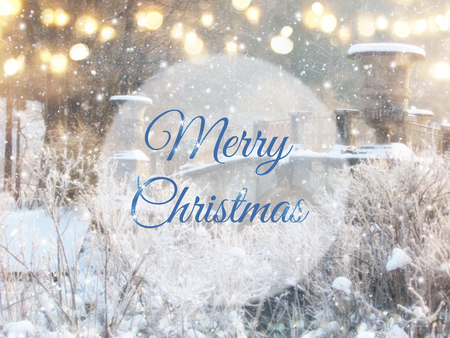 Blurry and abstract magical winter landscape photo with greeting text: Merry Christmas. Glitter overlayの写真素材
