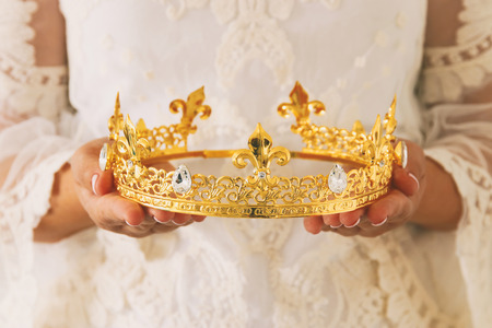 image of beautiful lady with white lace dress holding diamond crown. fantasy medieval periodの写真素材