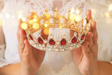 image of beautiful lady with white lace dress holding diamond crown. fantasy medieval periodの写真素材