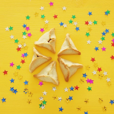 Purim celebration concept (jewish carnival holiday). Traditional hamantaschen cookies. Top view