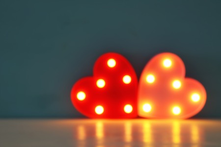 Valentine's day background with led glowing heartsの写真素材