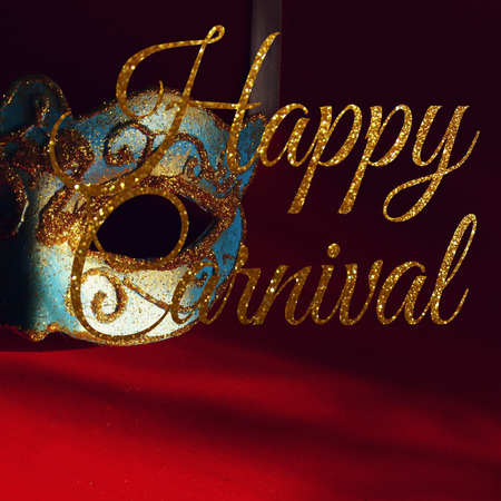 Image of elegant blue and gold venetian mask over red backgroundの写真素材