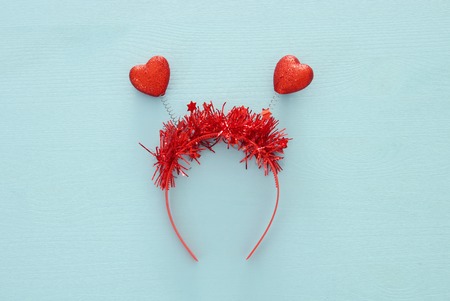 Top view image of funny party head glitter accessory with hearts. Flat layの写真素材