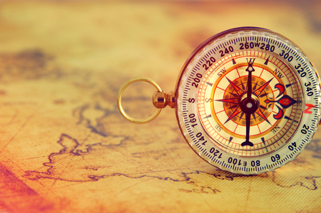 image of old compass over vintage map. selective focusの写真素材