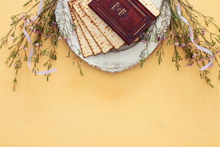 Pesah celebration concept (jewish Passover holiday). Traditional book with text in hebrew: Passover Haggadah (Passover Tale)の写真素材