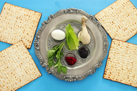 Pesah celebration concept (jewish Passover holiday). Traditional pesah plate with five symbols: horseradish, celery, egg, bone, maror, charosetの写真素材