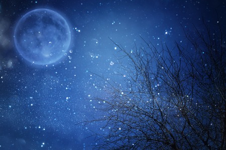 Surreal fantasy concept - full moon with stars glitter in night skies backgroundの写真素材
