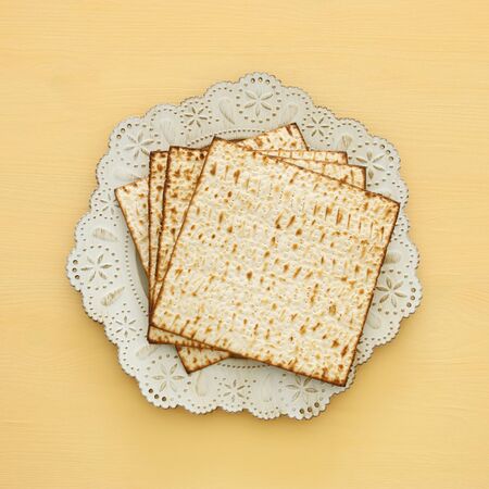 passover background with matzoh over yellow wooden backgroundの写真素材