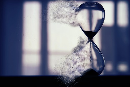 Hourglass as time passing and pass away conceptの写真素材