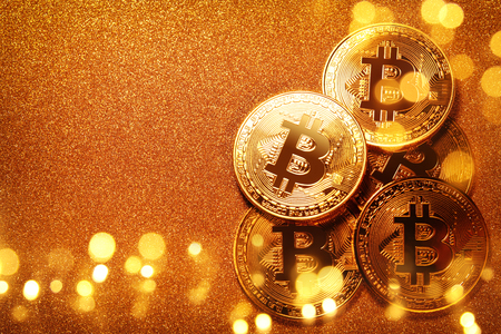 Bitcoin over gold glitter background. Business conceptの写真素材
