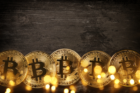 Golden Bitcoin over black background. Business conceptの写真素材