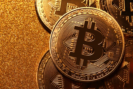 Bitcoin over golden glitter background. Business conceptの写真素材