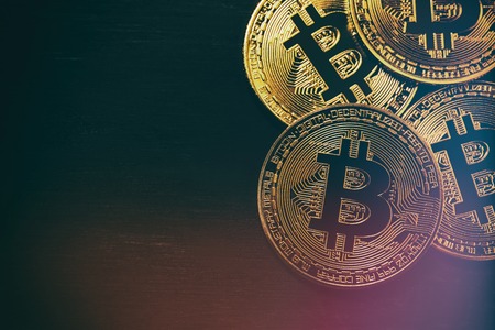 Golden Bitcoin over black background. Business conceptの写真素材