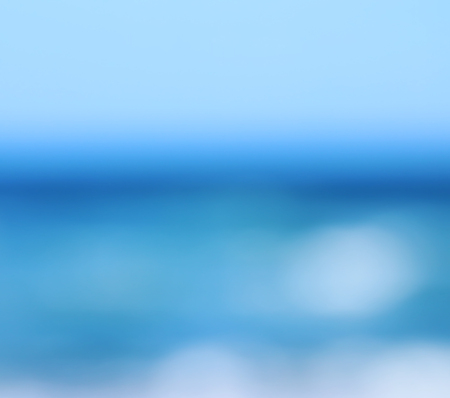 background of blurred beach and sea waves with bokeh sun light