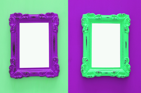 Vintage blank ultra violet and green photo frames over double colorful background. Ready for photography montage. Top view from aboveの写真素材