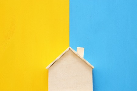 Top view Image of colorful house model over double colorful background. Real estate conceptの写真素材