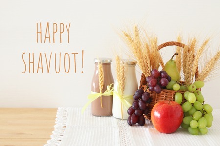 image of dairy products and fruits over wooden background. Symbols of jewish holiday - Shavuotの写真素材