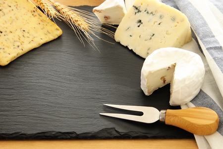 image of dairy products over black stone slate background. Symbols of jewish holiday - Shavuotの写真素材