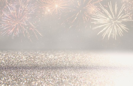 abstract gold and silver glitter background with fireworks. christmas eve, 4th of july holiday conceptの写真素材