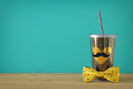 Image of black cup with golden heart. Father's day conceptの写真素材