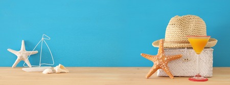 nautical, vacation and travel banner with sea life style objects over wooden tableの写真素材