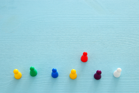 image of colorful game figures over wooden table ,human resources and management conceptの写真素材