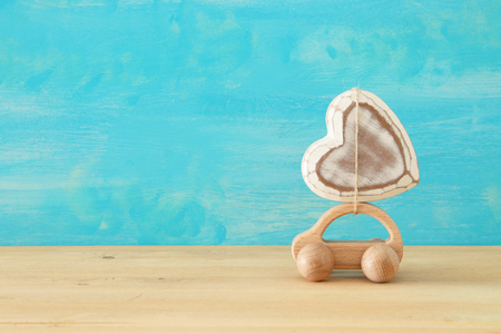Image of wooden car with heart on the roof, present for dad. Father's day conceptの写真素材