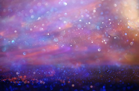 glitter vintage lights background. pink and purple. de-focused