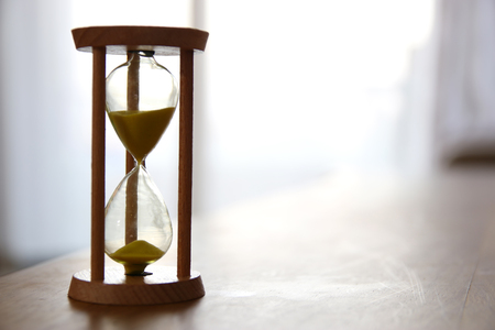 Hourglass as time passing concept for business deadlineの写真素材