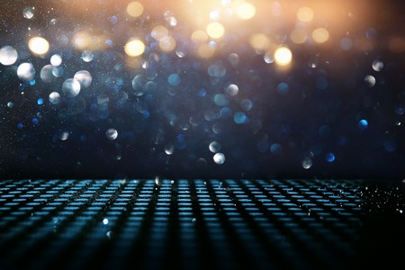 glitter vintage lights background. black, blue and gold. de-focusedの写真素材