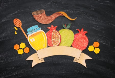 Rosh hashanah (jewish New Year holiday) concept. Traditional symbols shapes carved from paper and paintedの写真素材