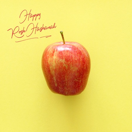 Flat lay image of red fresh apple. Rosh hashanah (jewish New Year holiday) concept. Traditional...