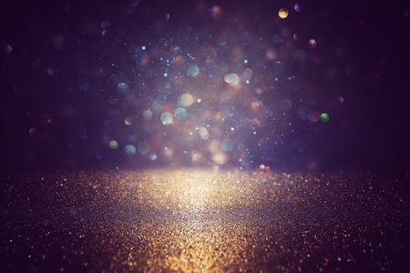glitter vintage lights background. black, blue and gold. de-focusedの写真素材