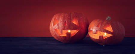 Halloween holiday concept banner. Pumpkins over wooden table.の写真素材
