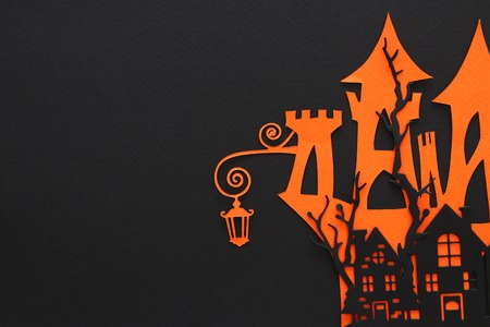 Halloween holiday concept. haunted witch house over black background. Top view, flat layの写真素材