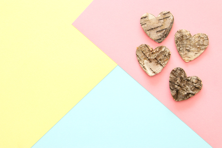 Abstract pastel colored paper texture. Minimal geometric shapes and lines. trendy design concept. wooden heart shapesの写真素材