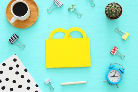 Shopping concept with paper bag and office supply. Flat lay, Top viewの写真素材