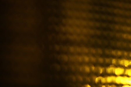 Abstract background of gold bokeh lightsの写真素材