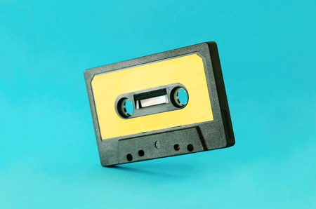 Retro cassette tape over blue background. Top view. Copy space for text.の写真素材