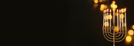 Image of Jewish holiday Hanukkah background with menorah (traditional candelabra) and candlesの写真素材