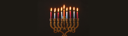 Image of Jewish holiday Hanukkah background with menorah (traditional candelabra) and candles