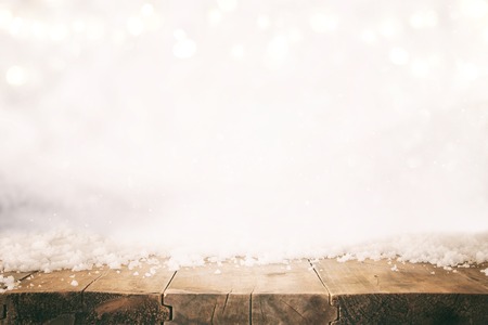 Image of old wooden table in front of glitter lights background. De-focused. Ready for product display montageの写真素材
