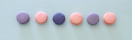 Top view of colorful macaron or macaroon over pastel blue background. Flat lay