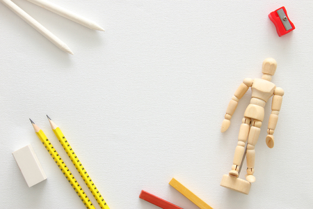 Top view of artist art supplies over white canvas background. Copy spaceの写真素材