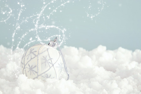 Image of christmas festive tree white ball decoration in front of pastel blue background backgroundの写真素材