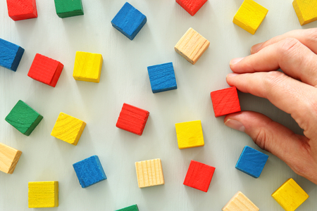 Top view of wooden colorful cubes.