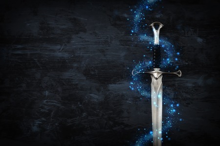 low key image of silver sword with magical lights. fantasy medieval periodの写真素材